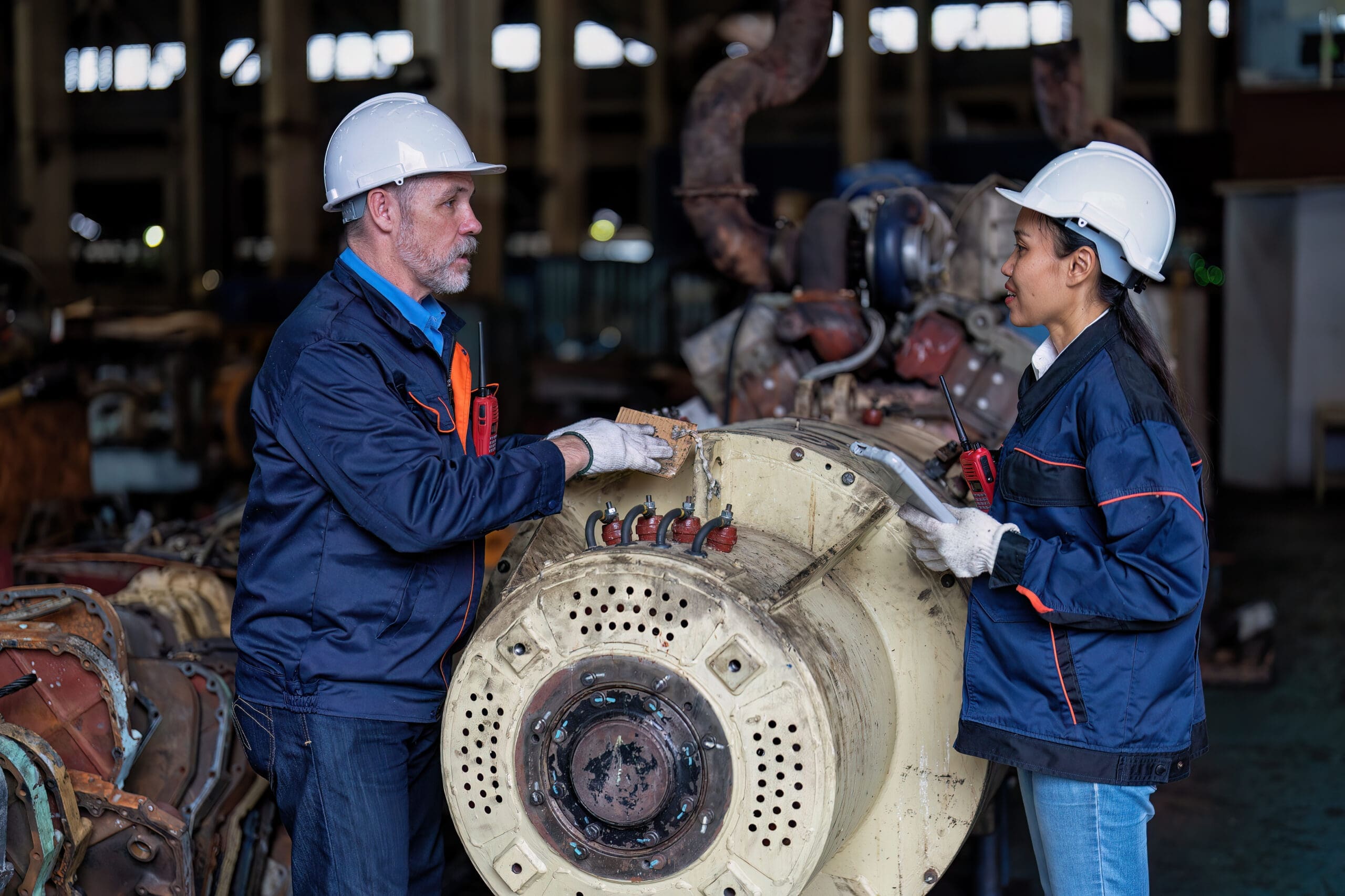 Maintenance manager and engineer checking part large engine supercharger prepare for overhaul repair